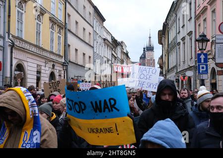 Poland - February 27, 2022: demonstration against Russian aggression in Ukraine, people with political banners Say no to Putin, Stop war, war Ukraine Stock Photo