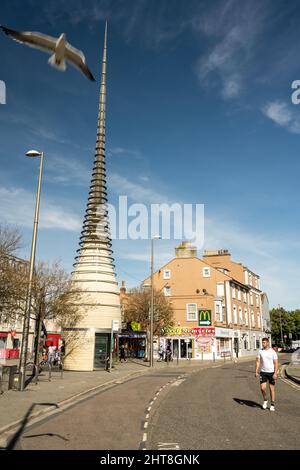 A sculptural bus shelter forms a landmark beside shops in the town centre of Weston-Super-Mare in Somerset. Stock Photo