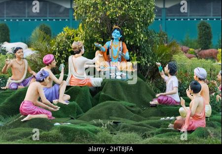 Figures of Krishna and his followers at Prem Mandir, Vrindavan, Mathura District, Uttar Pradesh, India Stock Photo