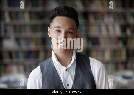 Head shot portrait of smiling Korean handsome man. Stock Photo