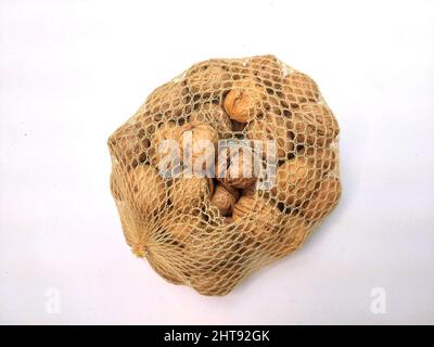 Healthy walnuts on the net for people and animals Stock Photo