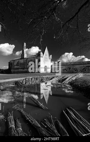 A grayscale of an old creepy stone building Stock Photo - Alamy