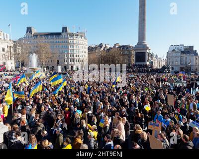 View of the large crowd of protesters gathered in Trafalgar Square London to protest at the Russian invasion of Ukraine Stock Photo