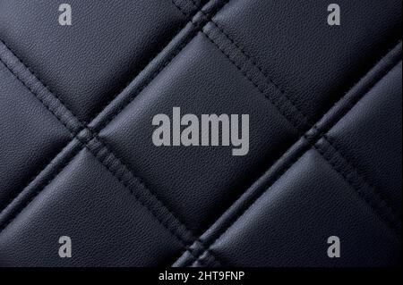textured detail of black capitone with diamonds or checks Stock Photo