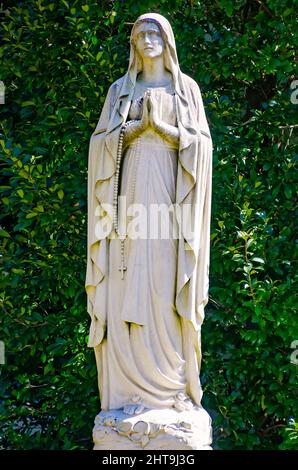 A statue of the Virgin Mary stands outside McGill-Toolen Catholic High School, Feb. 19, 2022, in Mobile, Alabama.