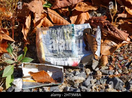 An empty pack of cigarettes litter the side of a road . Quebec,Canada Stock Photo