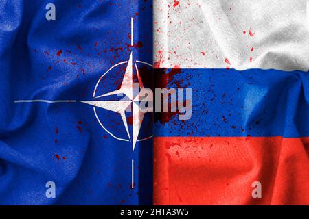 Russia and Nato flags with blood , war background concept Stock Photo