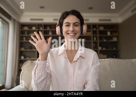 Web camera view cheerful millennial Hispanic woman starting video call. Stock Photo
