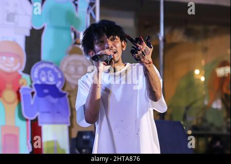 Bangkok, Thailand. 27th Feb, 2022. The rap artist aka 3Bone sings about social issues while performing art with color on paper. (Photo by Adirach Toumlamoon/Pacific Press) Credit: Pacific Press Media Production Corp./Alamy Live News Stock Photo