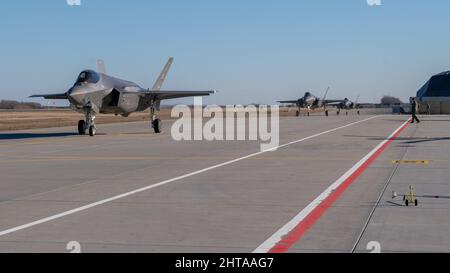 Three U.S. Air Force F-35 Lightning II aircraft assigned to the 48th Fighter Wing, Royal Air Force Lakenheath, England, arrive at Siauliai Air Base, Lithuania, Feb. 27, 2022, in support of NATO’s collective defense. The fifth generation aircraft will be supporting NATO’s Enhanced Air Policing mission for an extended period from forward operating locations in the Baltic region. (U.S. Air Force photo by Senior Airman John R. Wright) Stock Photo