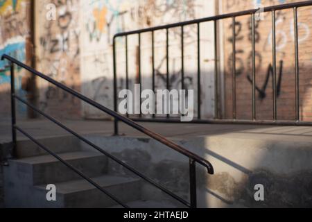 View of stairs against graffiti wall background Stock Photo