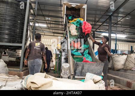 A worker loads waste plastic bags on a conveyor for recycling at a recycling plant.Discussions to chart a way forward for a global plastic treaty to address the growing problem of plastic pollution are set to begin this week during the United Nations Environmental Assembly UNEA 5.2). With two draft resolutions on the table, member countries will decide to either to address the full life cycle of plastics as proposed by Rwanda and Peru or go with Japan's draft resolution that puts emphasis of better management of plastic waste. More than 50 countries and environment groups are supporting regula Stock Photo