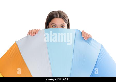 kid behind multicolored rain protection parasol isolated on white background, weather forecast. Stock Photo