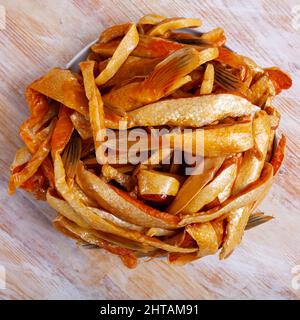 Smoked salmon belly flaps on plate Stock Photo