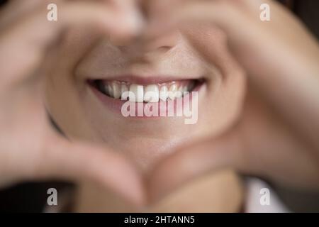 Close up happy young woman showing healthy smile. Stock Photo