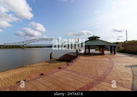 View of Julien Dubuque Bridge and a gazebo by Mississippi river against a blue sky on a sunny day Stock Photo