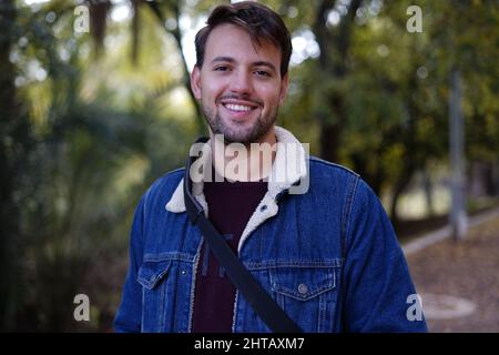 Young White guy smiling looking in the camera dressed casually Stock Photo