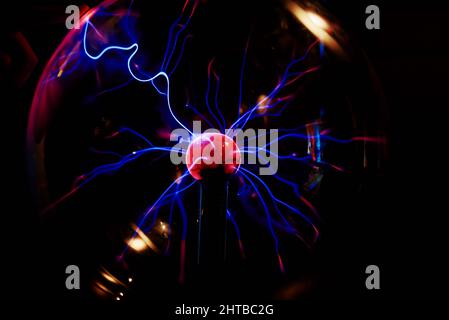 Plasma ball with energy rays on dark background, Physic model of plasma sphere Stock Photo