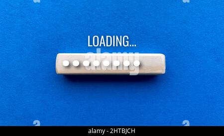 Top view of loading bar with blue texture background.Digital concept Stock Photo