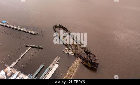 Aerial view of a rusted old broken boat on the Hudson River in upstate New York Stock Photo