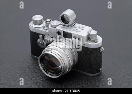 Kagawa, Japan - February 27, 2022: Leica ⅢG rangefinder camera with Leitz 50mm f1.4 Summilux L-mount lens. Vintage collectible classic lens concept. Stock Photo