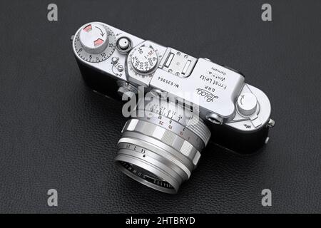 Kagawa, Japan - February 27, 2022: Leica ⅢF rangefinder camera with Leitz 50mm f1.4 Summilux L-mount lens. Vintage collectible classic lens concept. Stock Photo