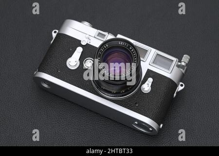 Kagawa, Japan - February 27, 2022: Leica M3 rangefinder camera with Leitz 50mm f2 Summicron M-mount lens. Vintage collectible classic lens concept. Stock Photo
