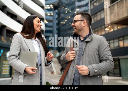 Young business people talking and working outdoor. Business woman man lifesytle city concept. Stock Photo