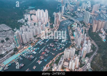 amazing drone shot of cloudy evening in Aberdeen, Hong Kong. Fishing ships and yacht. Near the Typhoon Shelter area Stock Photo