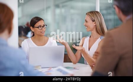 Its splendidly simple. Shot of two female colleagues discussing ideas. Stock Photo