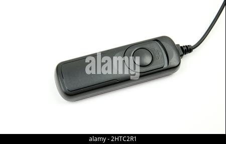 Black remote shutter release on white background Stock Photo