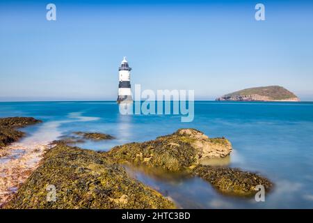 Penmon Lighthouse and Puffin Island, Anglesey, North Wales. Stock Photo