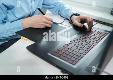 Graphic designer using digital tablet and computer in office Stock Photo