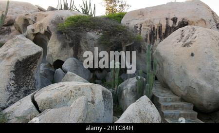 Scenic view of the Ayo Rock Formations with stairs and vegetation in Aruba Stock Photo