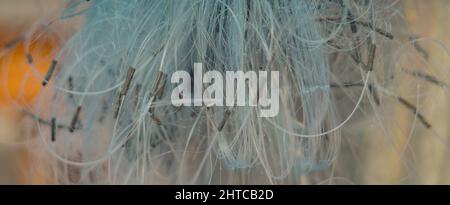 BANNER Abstract real photo white gray pale blue background. Close sail sea fishing tangled line airy mesh texture. Geometric waves circles threads Stock Photo