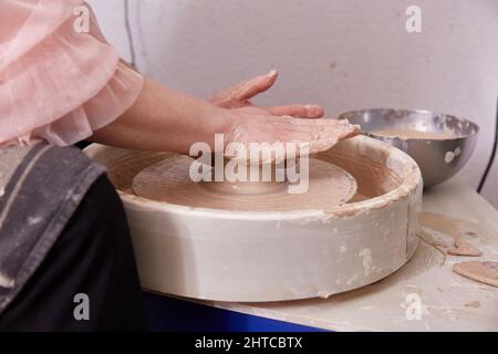 Work on the potter's wheel. bowl making Stock Photo