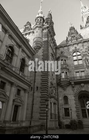 Greyscale vertical low angle shot of the townhall in Hamburg Stock Photo