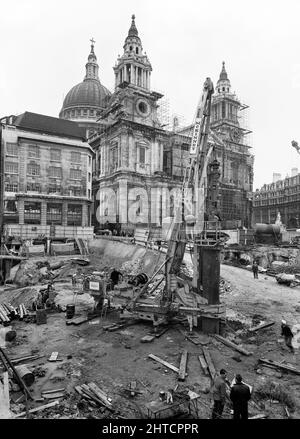 St Paul's Cathedral, St Paul's Churchyard, City of London, 01/10/1963. A McKinney DAG 60 drilling rig in operation during the construction of the Paternoster development, with the west end of St Paul's Cathedral in the background. Work on the Paternoster development was carried out in a joint venture by John Laing Construction Limited, Trollope and Colls Limited, and George Wimpey and Company Limited. The scheme involved the redevelopment of a seven acre site on the north side of St Paul&#x2019;s Cathedral. The site had been almost entirely devastated during an incendiary raid in December 1940 Stock Photo