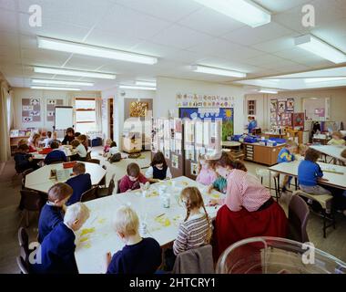 Whingate Primary School, Whingate Road, Leeds, 09/03/1989. Children working at tables in a classroom at Whingate Primary School, Leeds. Laing's Yorkshire Region division built three schools as a combined &#xa3;4m contract for Leeds City Council. Whitecote, Harehills and Whingate primary schools were all built between September 1987 and September 1988. All three were of traditional brick and block construction with hipped tiled roofs. The design followed the same template but Whingate was a mirror image of the other two. Stock Photo