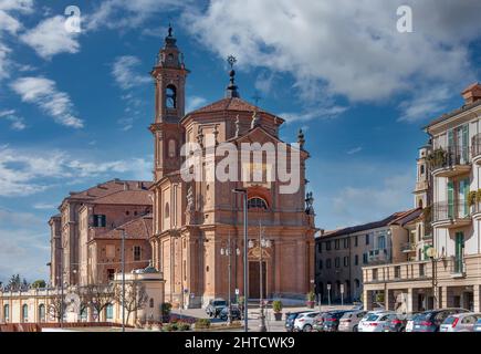 Fossano, Cuneo, Italy - February 27, 2022: Church of Holy Trinity or dei Battuti Rossi (18th century arch Francesco Gallo) in baroque style, on blue s Stock Photo