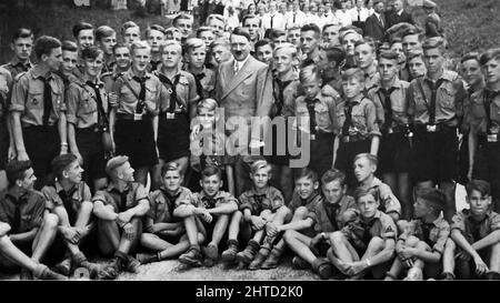 ADOLF HITLER (1889-1945)  with members of the Hitler Youth at Obersalzberg in 1938 Stock Photo
