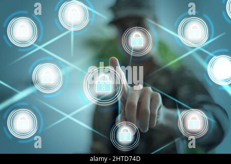 Soldier pressing text data integration button on a virtual interface. Big Database Military Technology. Data Integration Information Modern Innovative Stock Photo