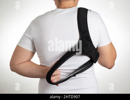 A Male Is Wearing An Orthopedic Posture Corrector Treatment For Stoop And  Back Problems Closeup The Guy Sits On A Chair In The Office Stock Photo -  Download Image Now - iStock