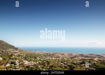 view from the top of mijas looking out at the coast line below Stock Photo