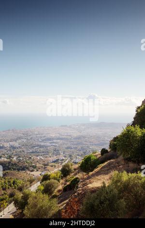 view from the top of mijas looking out at the coast line below Stock Photo
