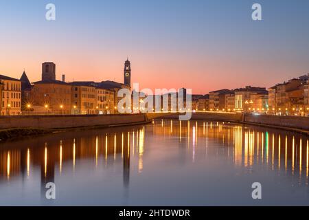 Pisa, Italy skyline on the Arno River at dusk. Stock Photo