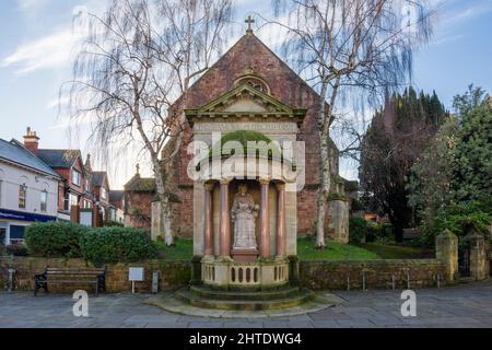 The statue of Queen Anne in Wellington Square with St Andrews Church behind in the coastal town of Minehead, Somerset, England. Stock Photo