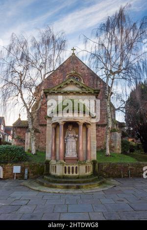 The statue of Queen Anne in Wellington Square with St Andrews Church behind in the coastal town of Minehead, Somerset, England. Stock Photo