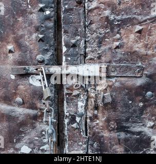 Old steel door with padlock Stock Photo