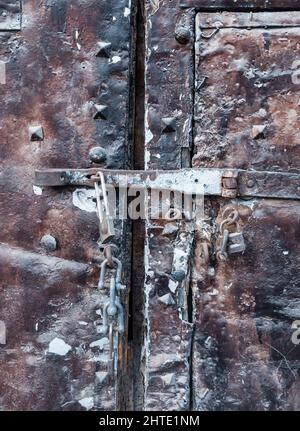 Old steel door with padlock Stock Photo